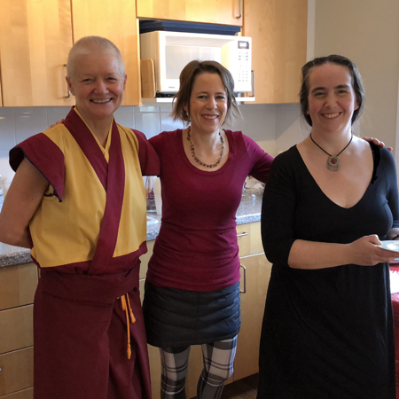 Smiling members in the kitchen of Joyful Land Kadampa Buddhist Centre in Ottawa