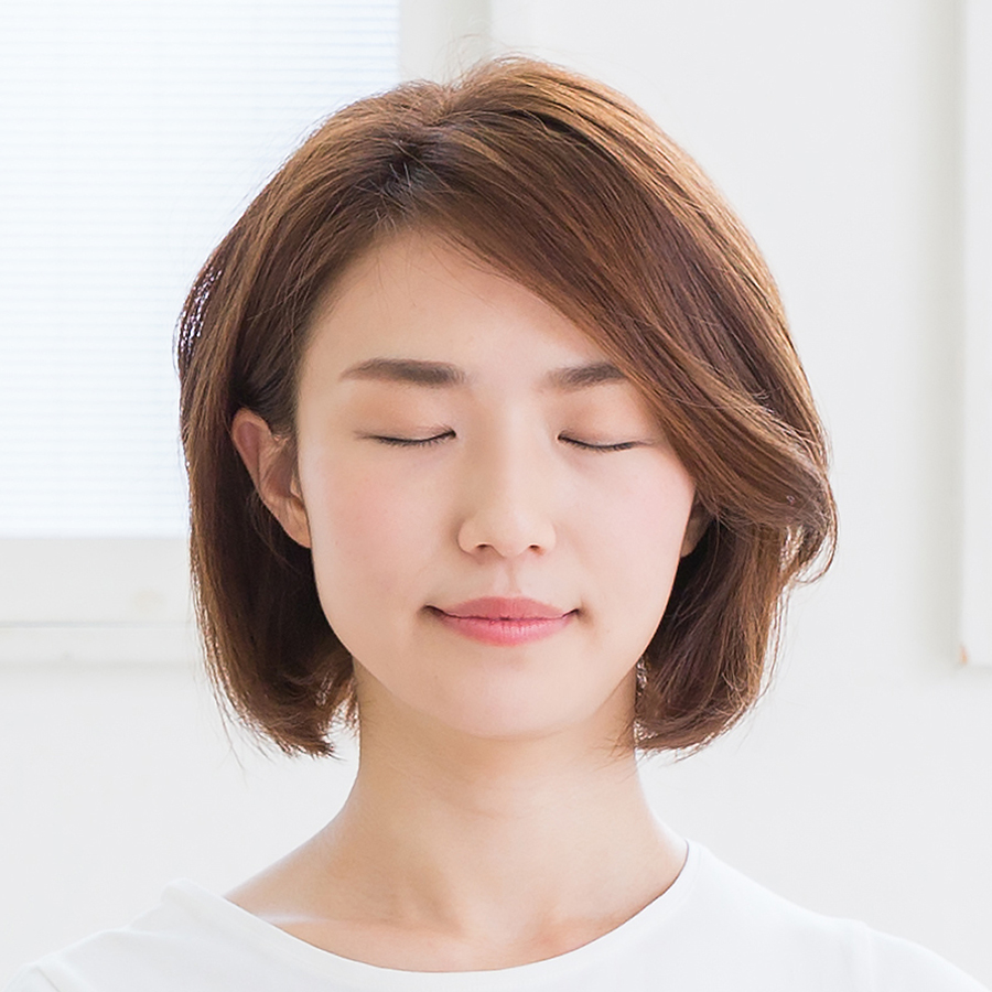 Young woman peacefully meditating