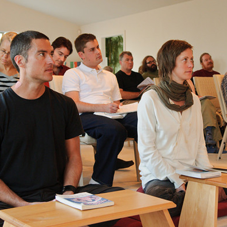 People listening at a Saturday Morning Course