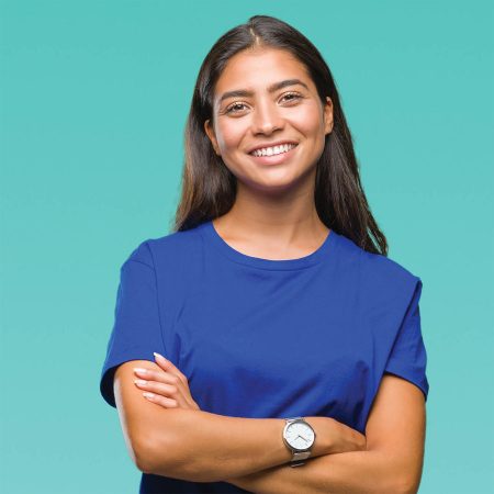 Young woman with arms crossed, looking confident