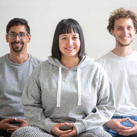 People in a meditation classes, smiling at camera